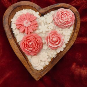 Love at first light!  Beautifully crafted wooden heart candle available in rose  fragrance.