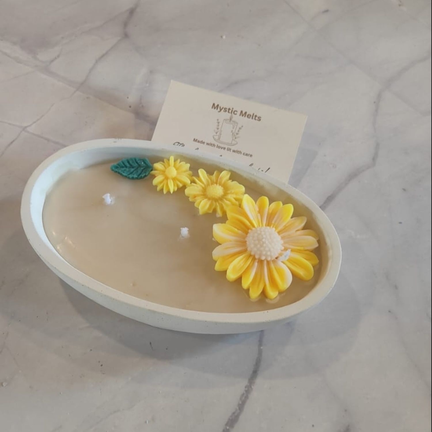Unique ceramic boat candle adorned with beautiful daisy flower